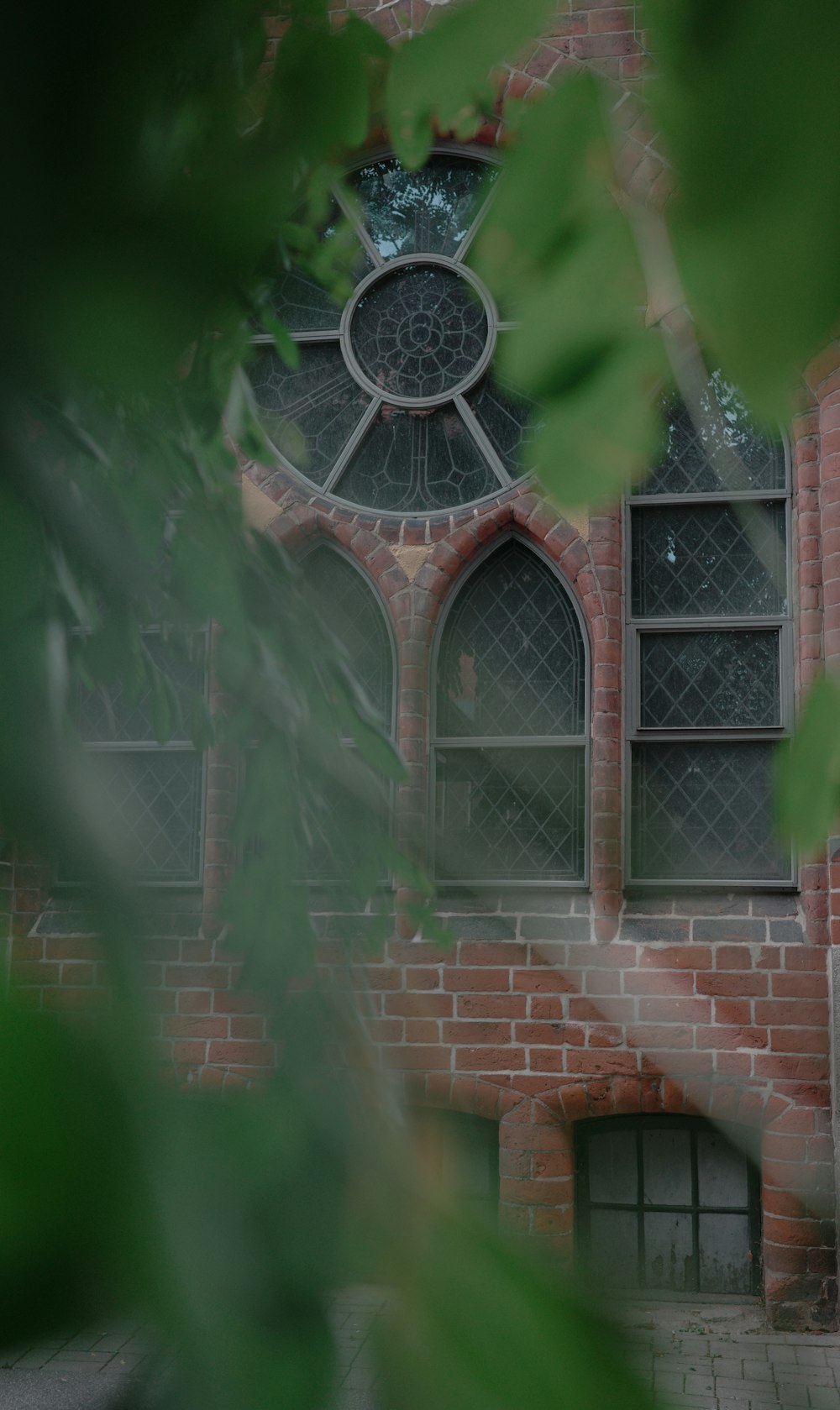 a red brick building with a large window