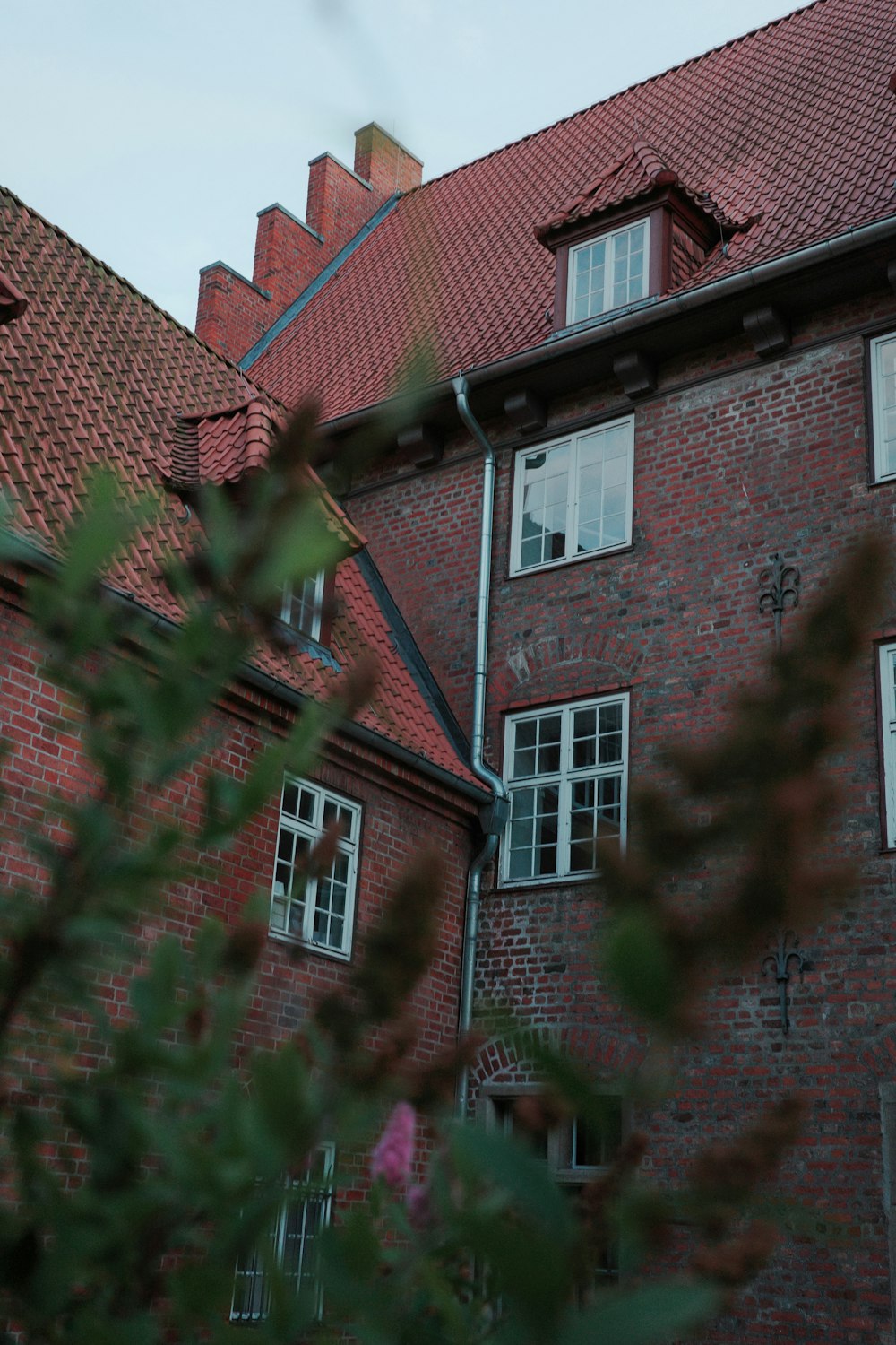 a red brick building with a clock on the front of it