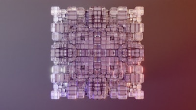A symmetrical arrangement of transparent, three-dimensional cubes forms a geometric pattern. The cubes vary in size and are intricately stacked, creating a visually complex structure. The background is a gradient of neutral and warm tones.