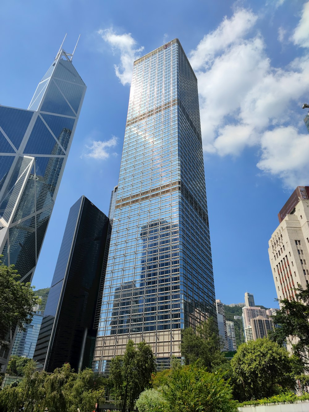 a very tall building surrounded by other tall buildings