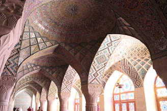 An intricately designed mosque interior showcasing beautiful Islamic geometric patterns.