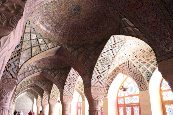 An intricately designed mosque interior showcasing beautiful Islamic geometric patterns.