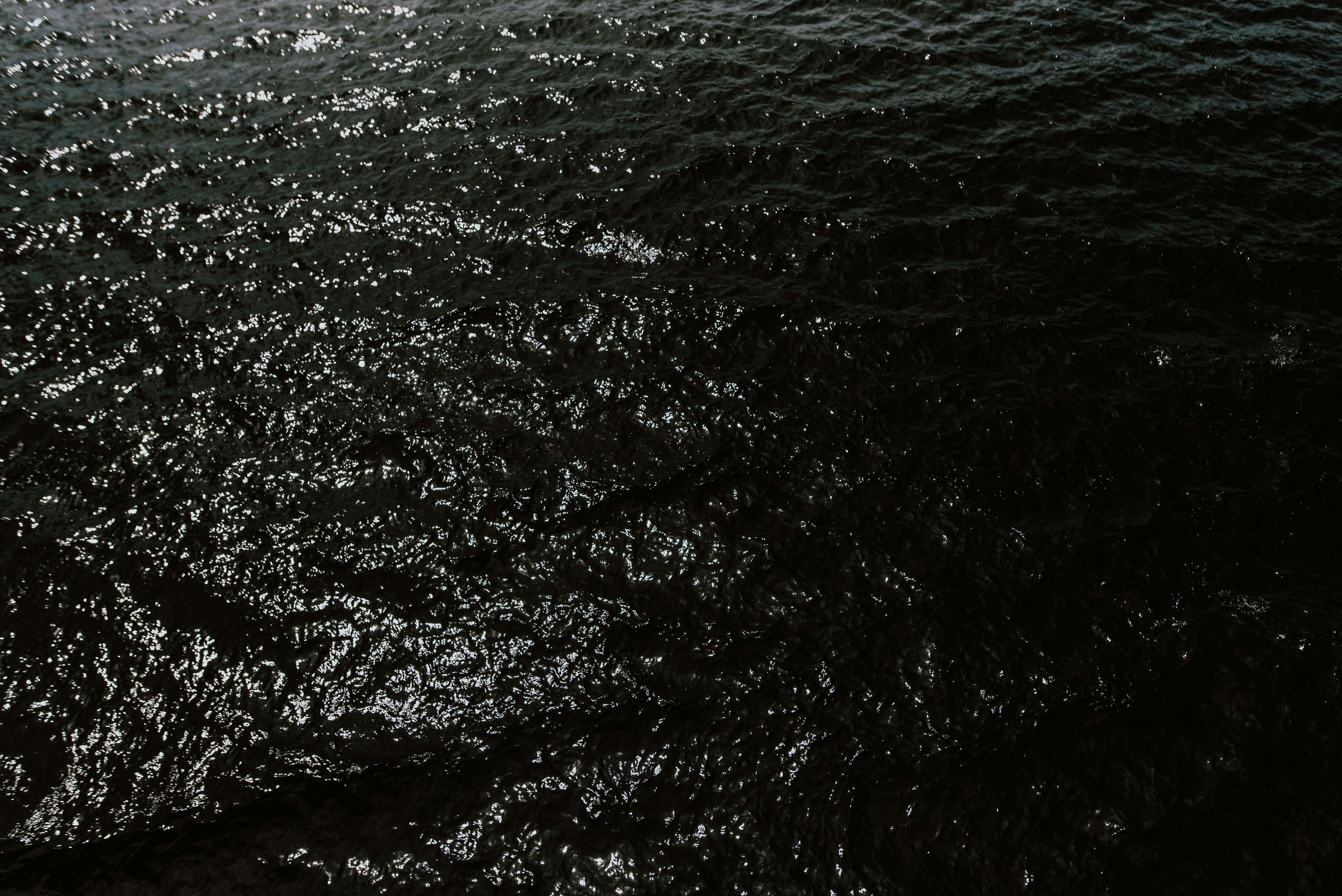 a black and white photo of the water