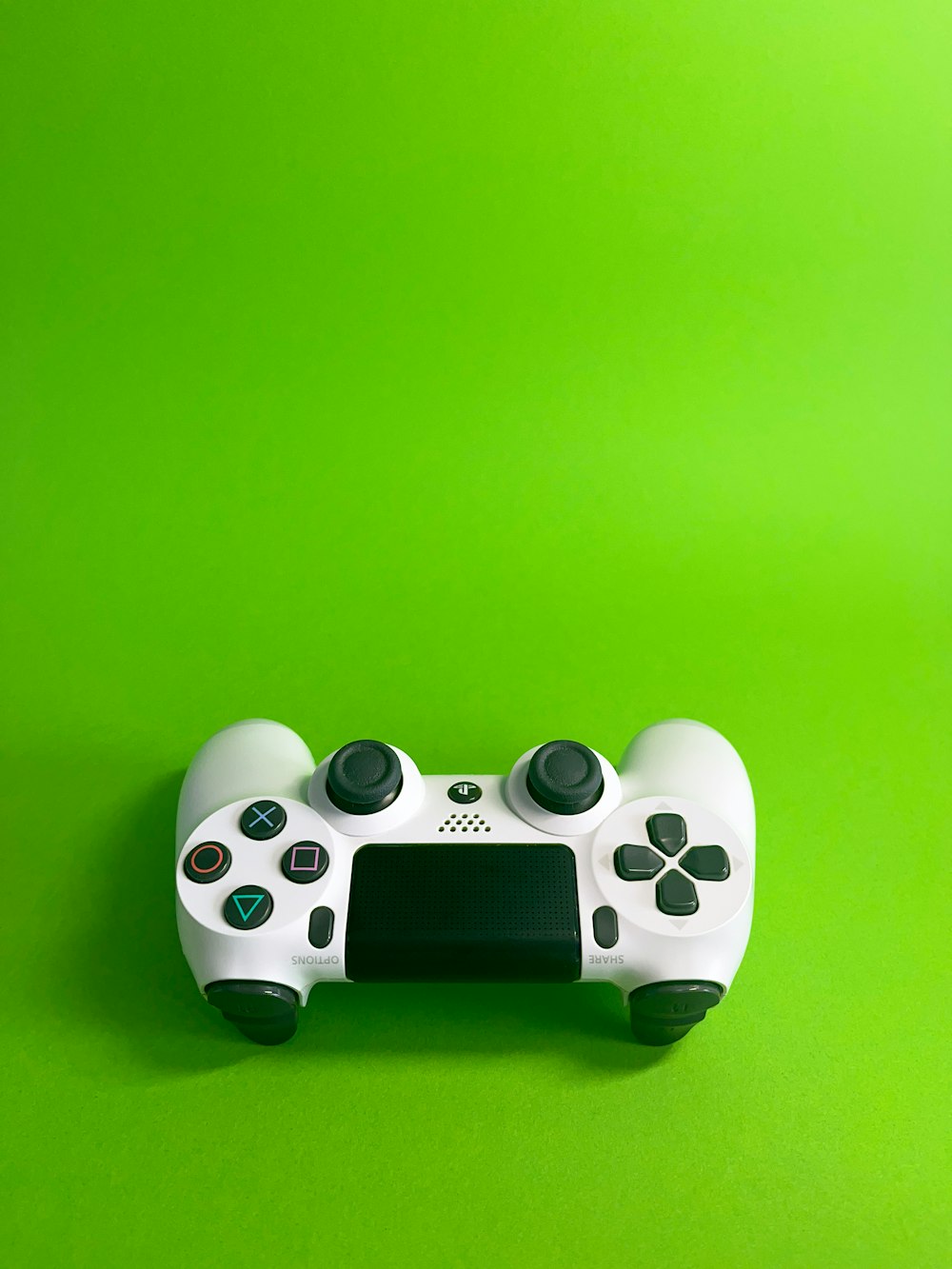 a video game controller on a green background