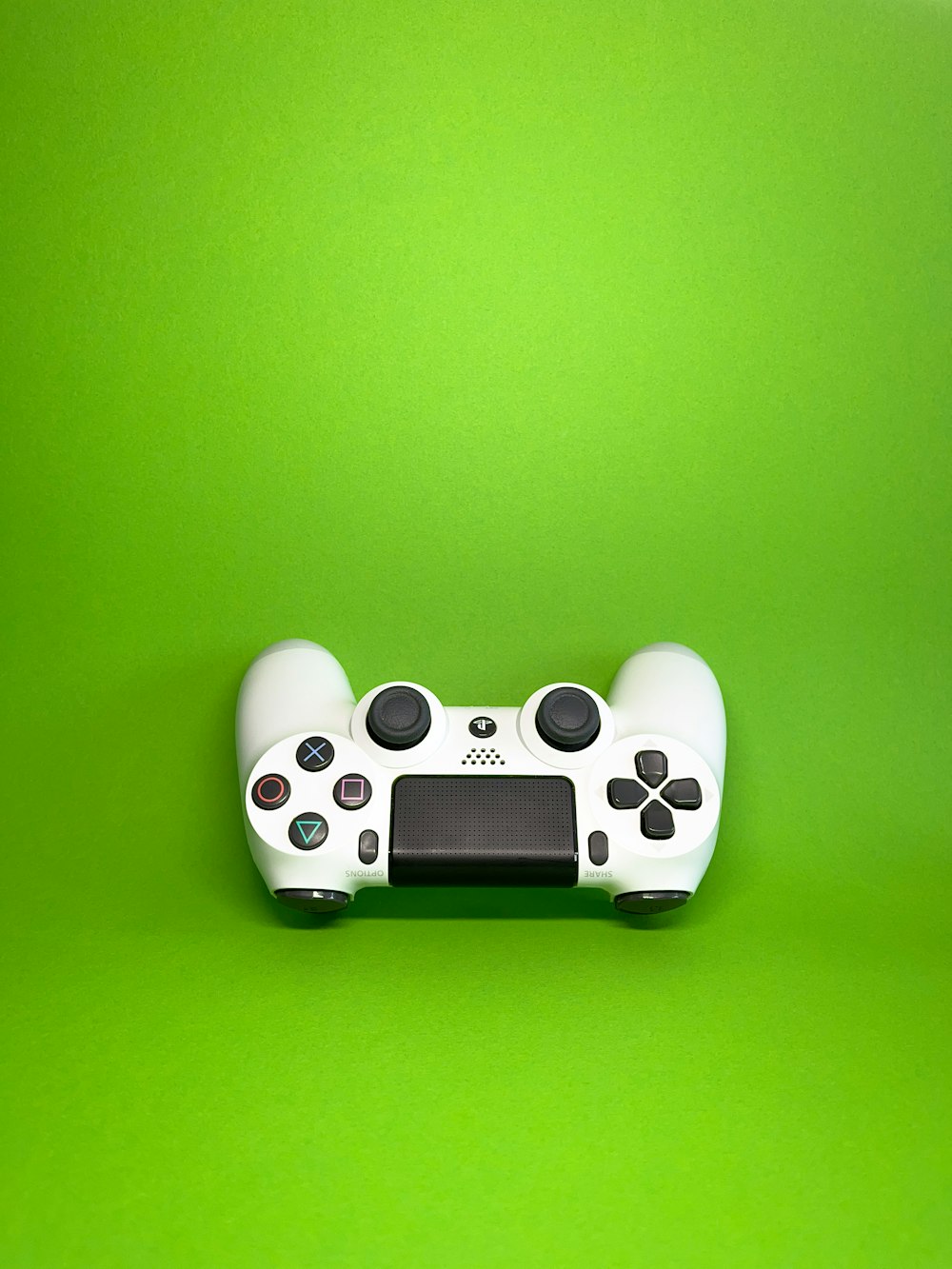 a video game controller on a green background