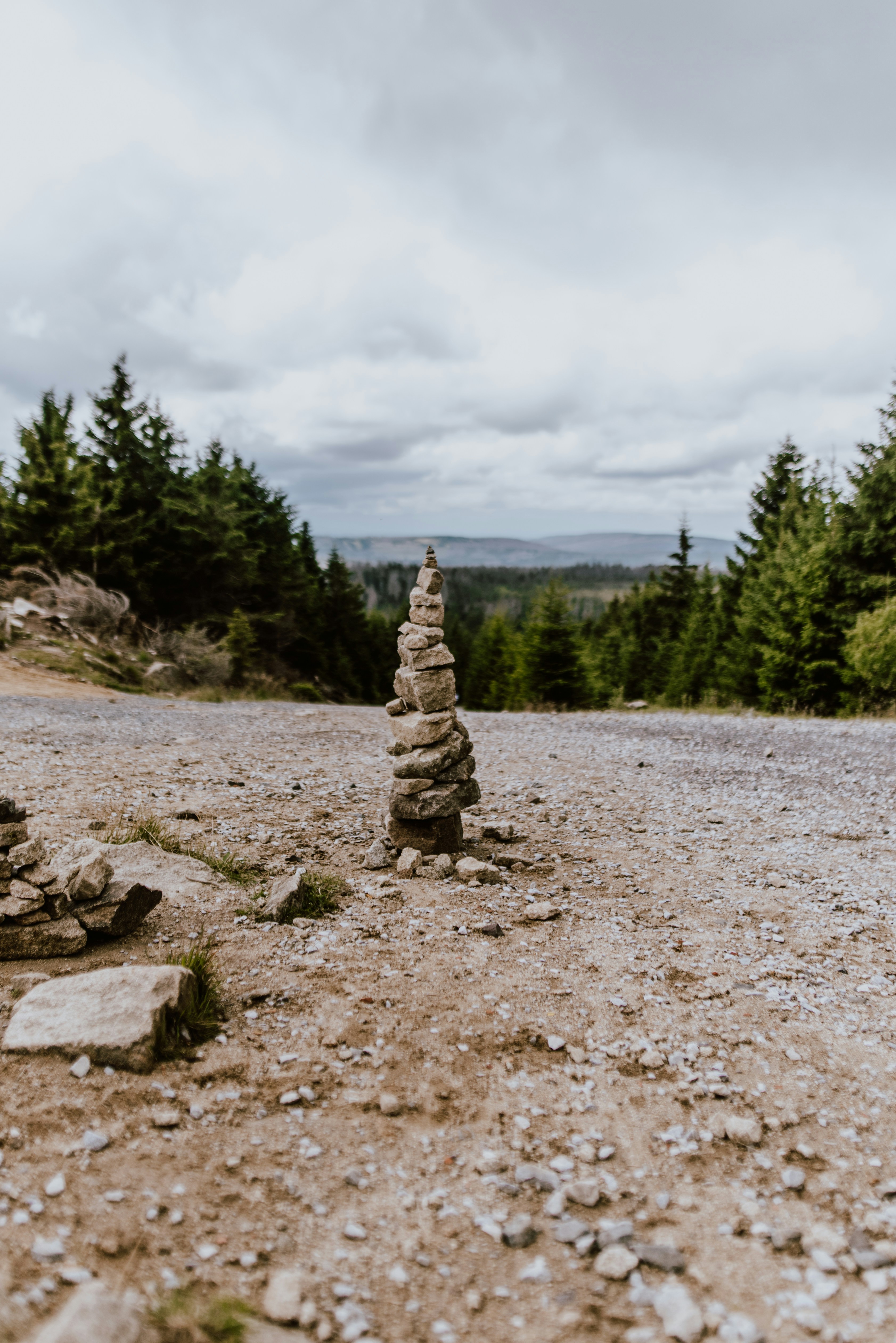 a pile of rocks sitting on top of a dirt road