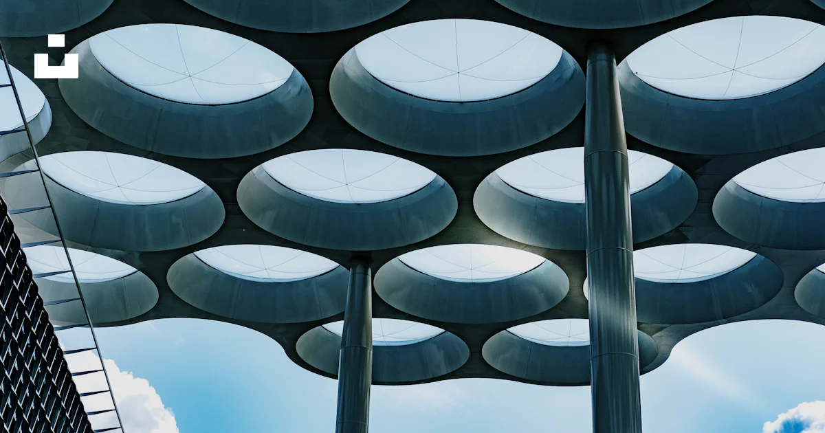 Ceiling Objects A group of round objects hanging from the ceiling of a building photo ...