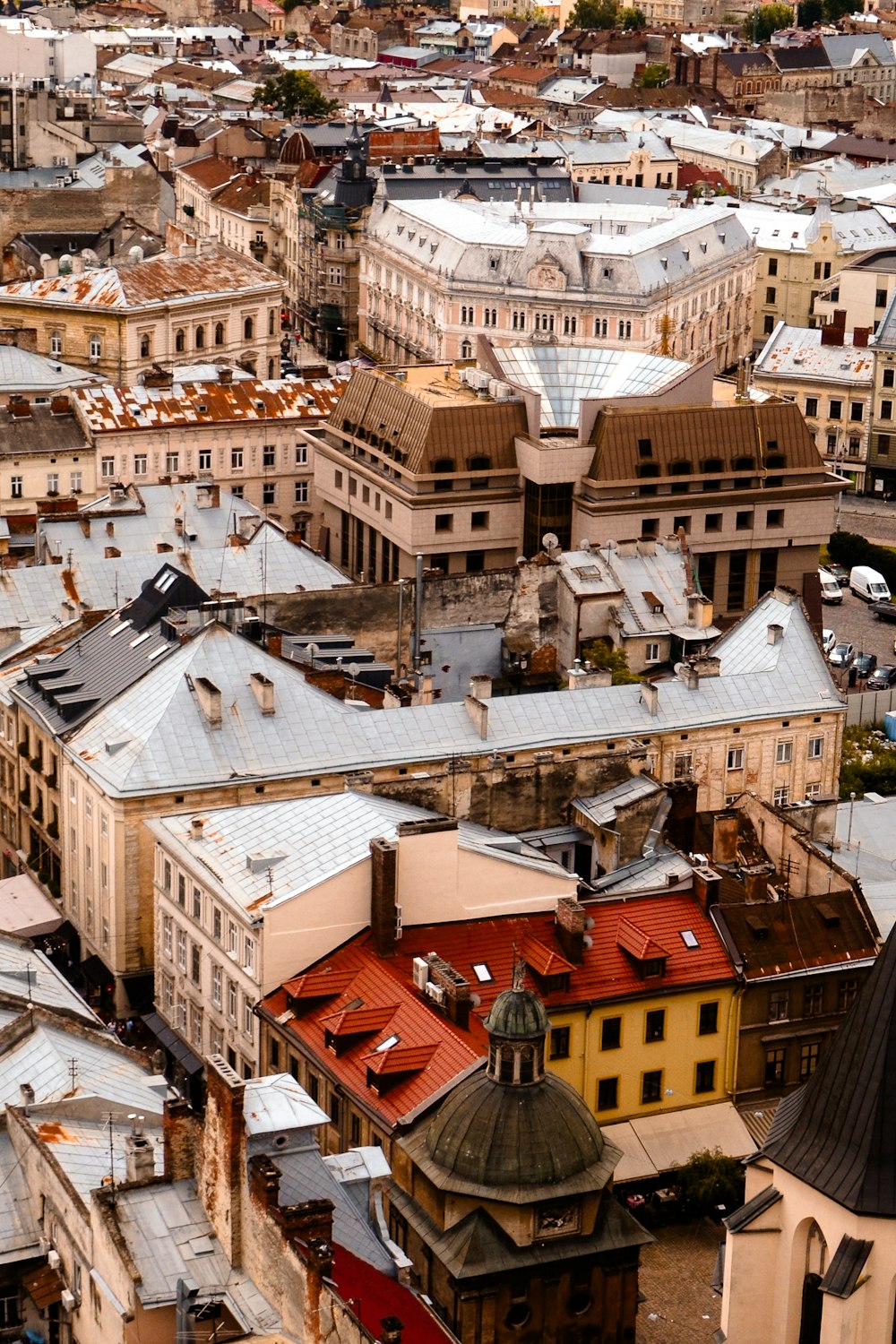 an aerial view of a city with buildings and a clock tower