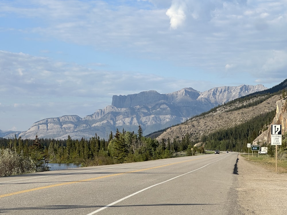 a road with a mountain in the background