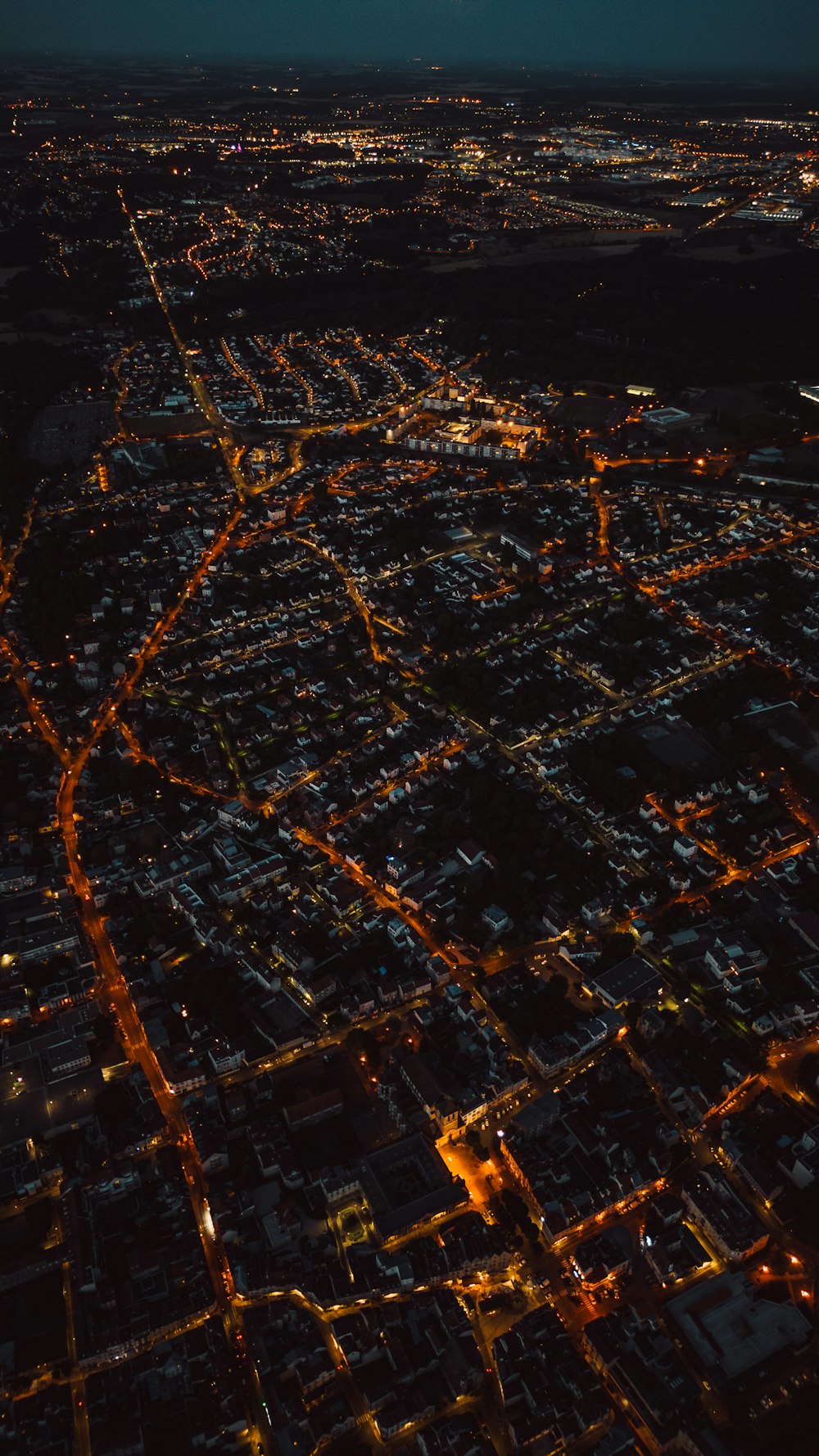 an aerial view of a city at night