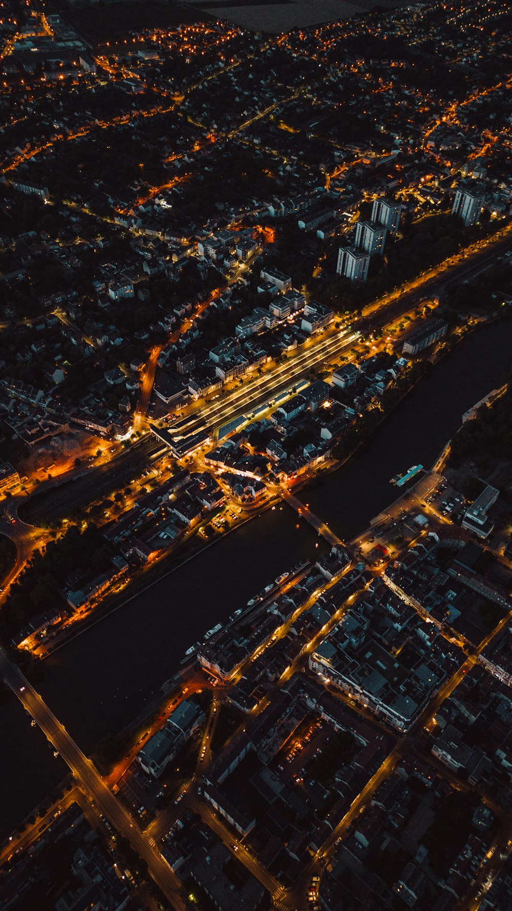 an aerial view of a city at night