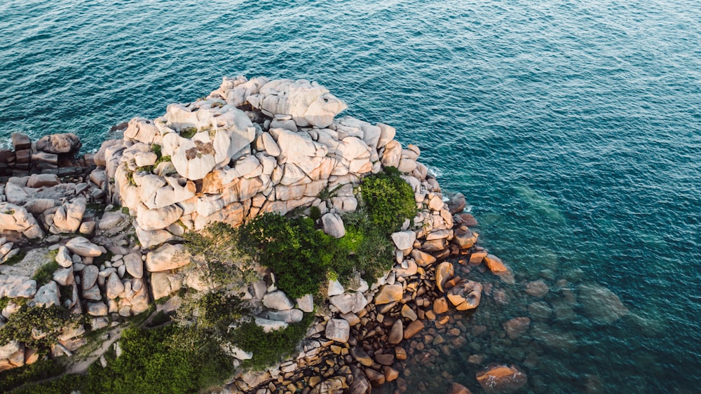 a rock outcropping in the middle of the ocean