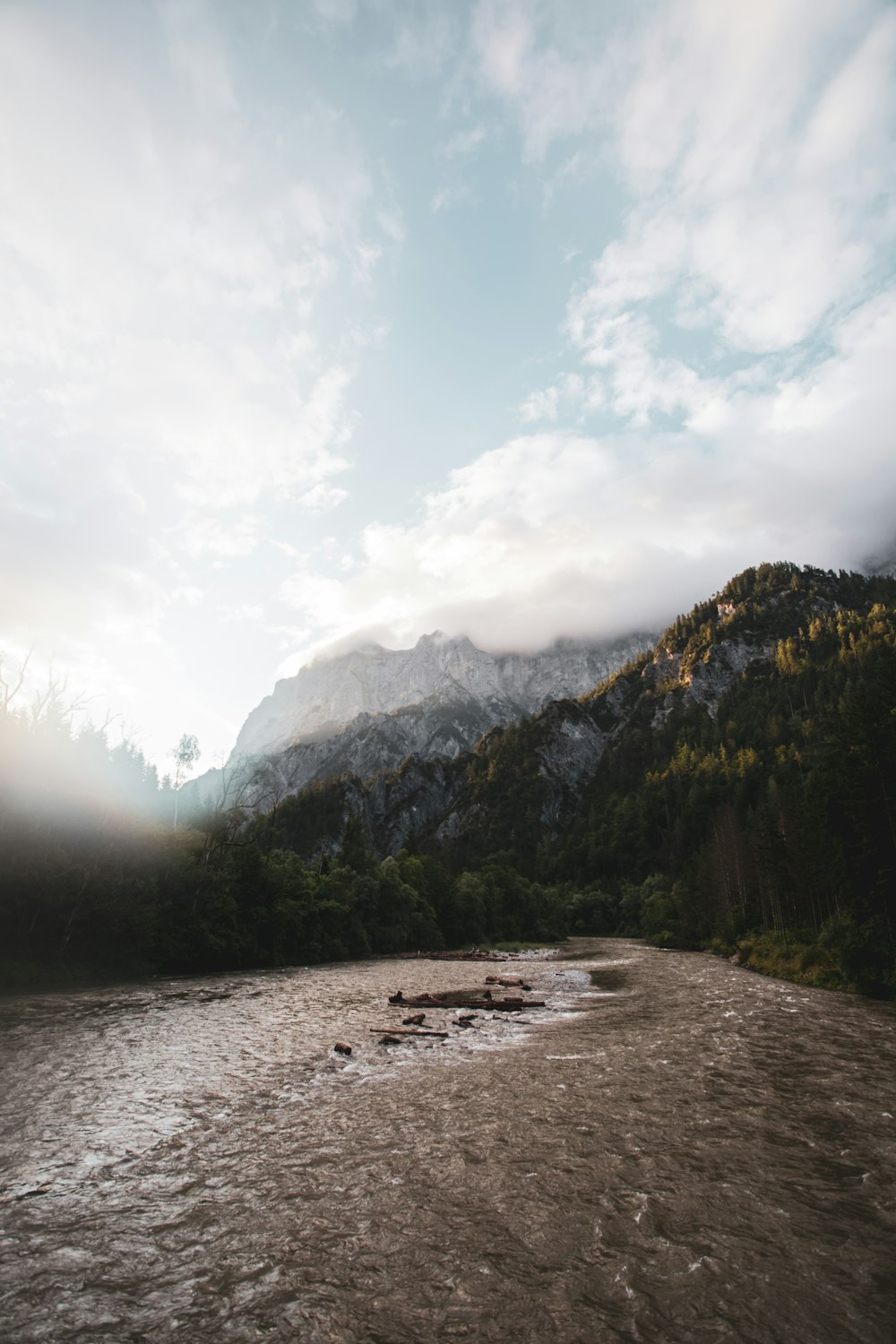 a river with a mountain in the background