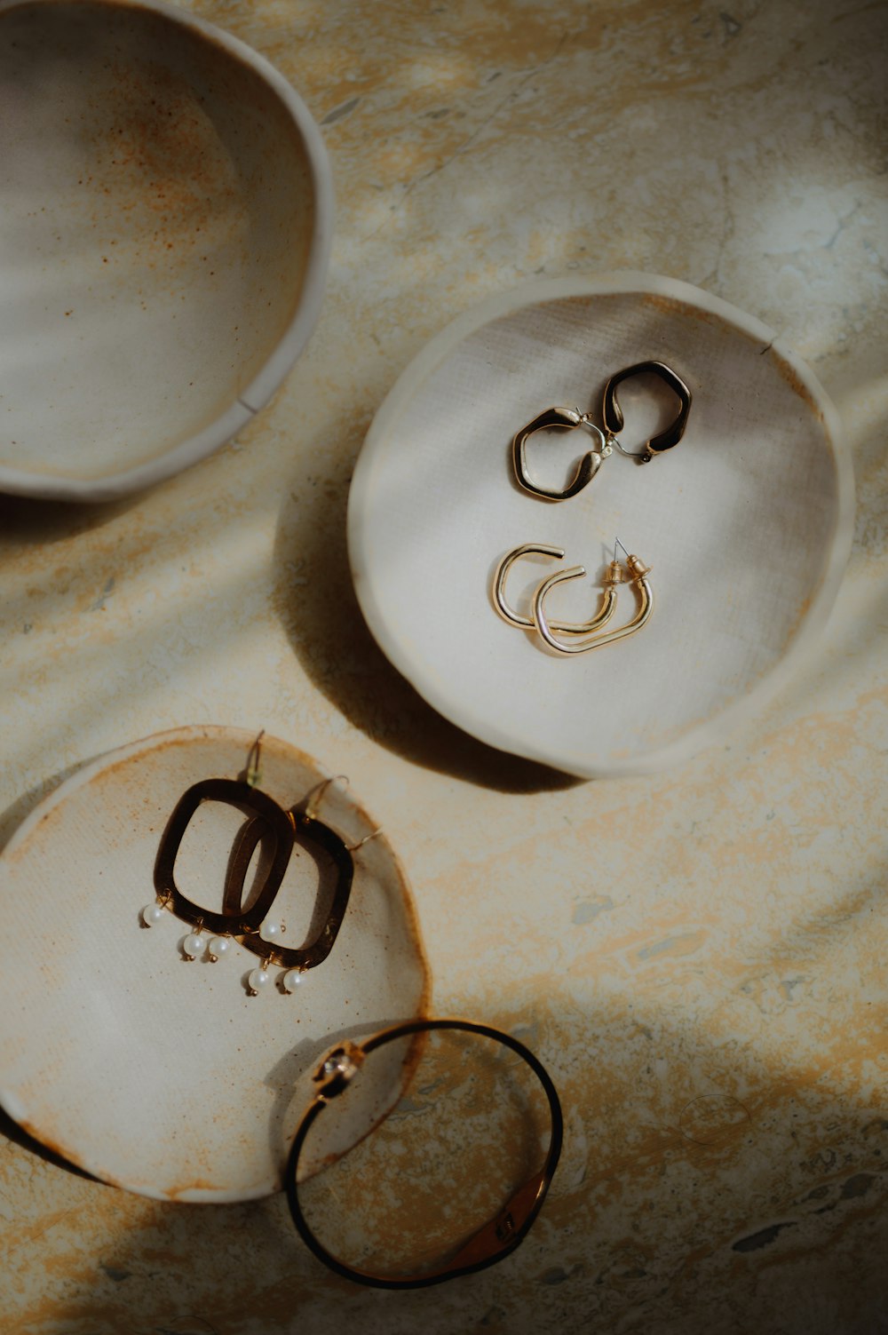 a couple of white plates sitting on top of a table