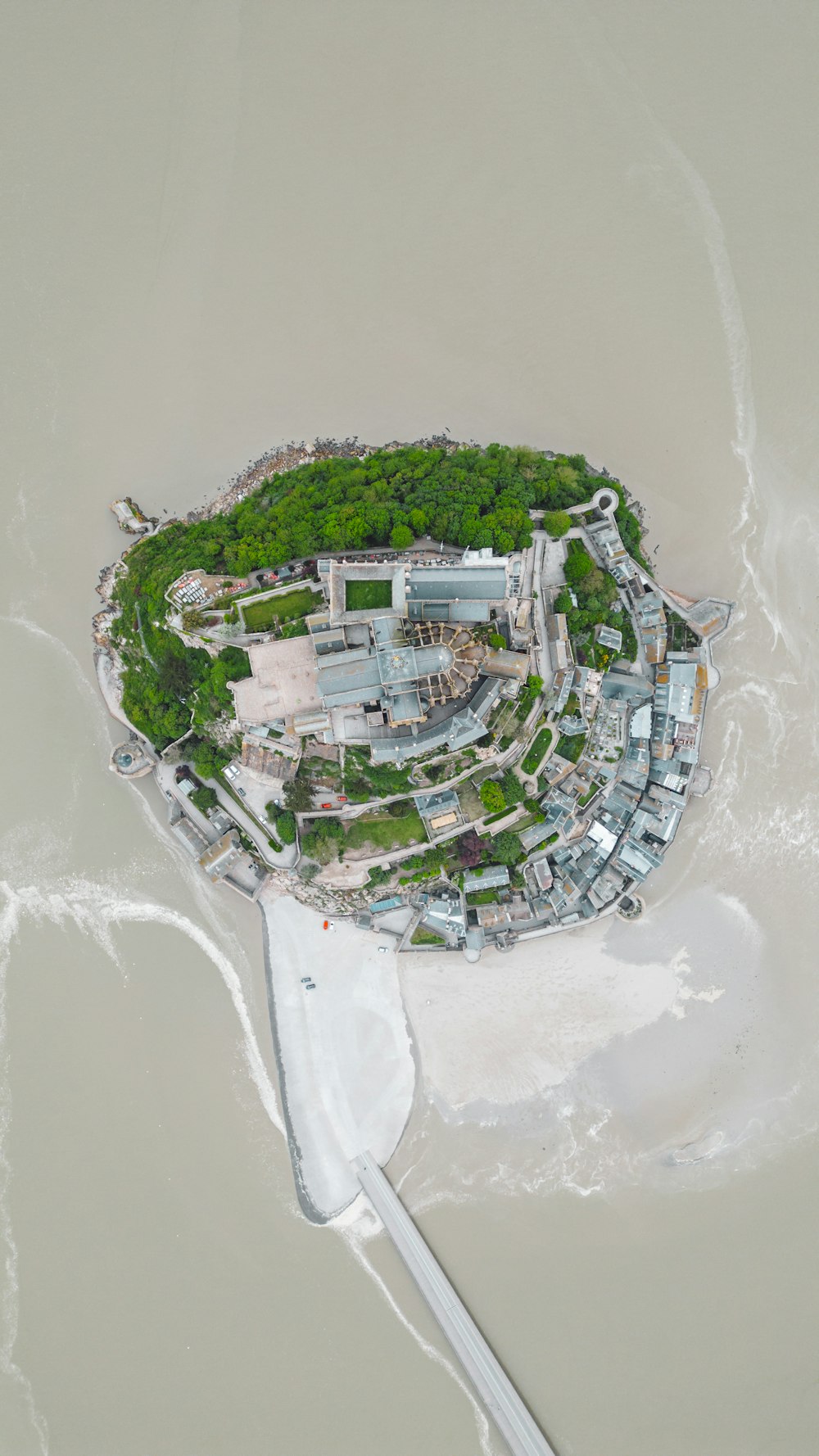 an aerial view of an island in the water