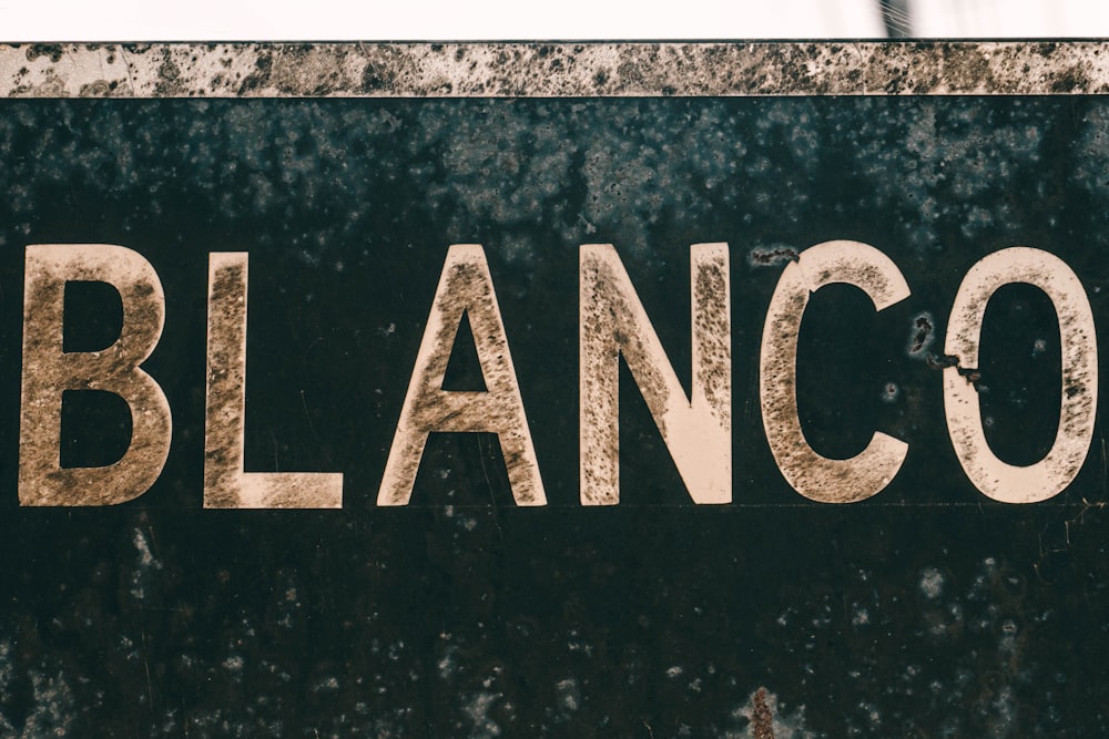 a close up of a street sign with a sky background