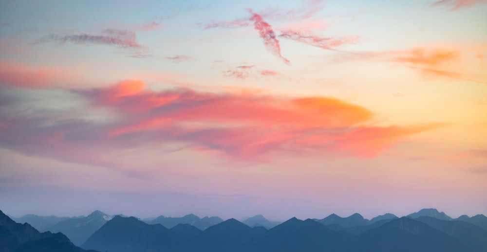 a view of a mountain range at sunset