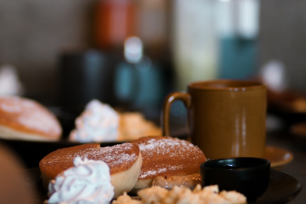 a table topped with pastries and a cup of coffee