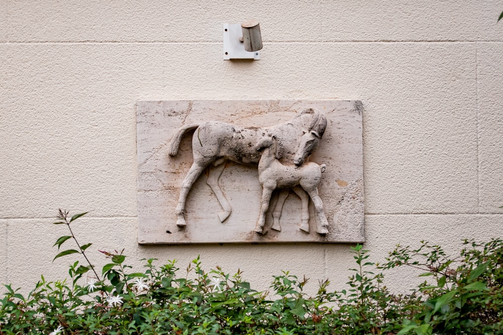 a sculpture of a mother horse and her baby