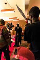 Actors rehearsing a dramatic courtroom scene in a cozy studio space.