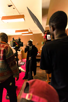 Behind the scenes of a film set with cameras and lighting equipment