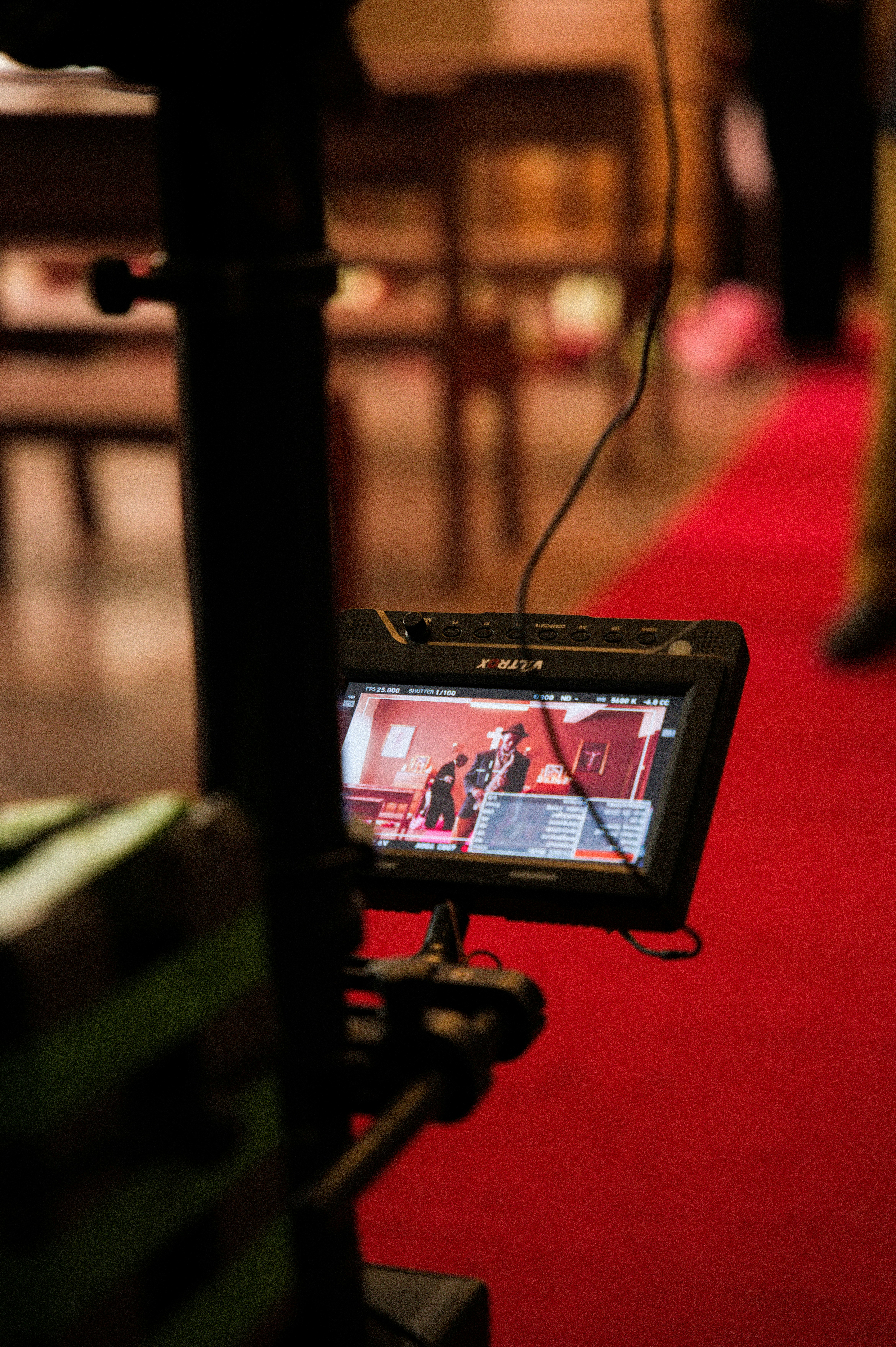 a video camera set up on a red carpet