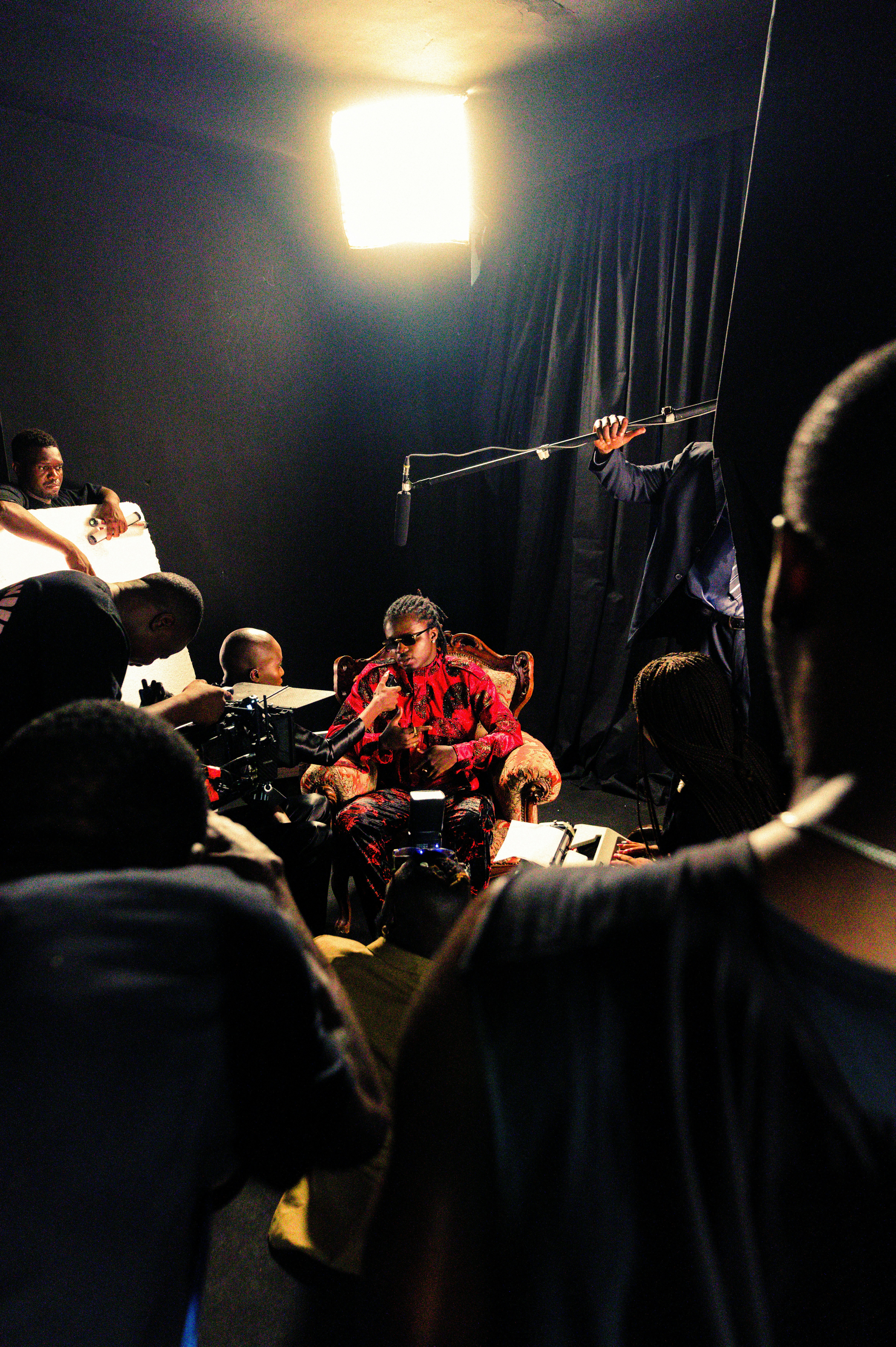 a group of people sitting in a dark room
