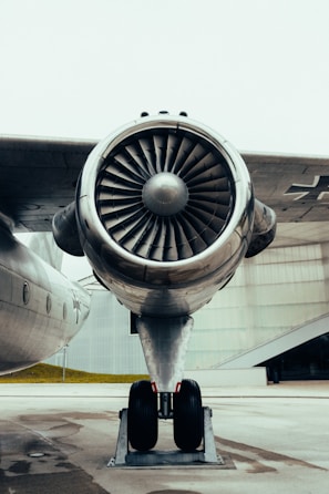 Close-up of airplane engine components neatly arranged on a workbench.