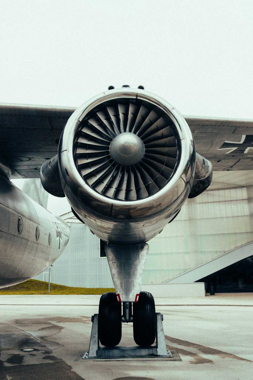 a jet engine sitting on top of an airport tarmac