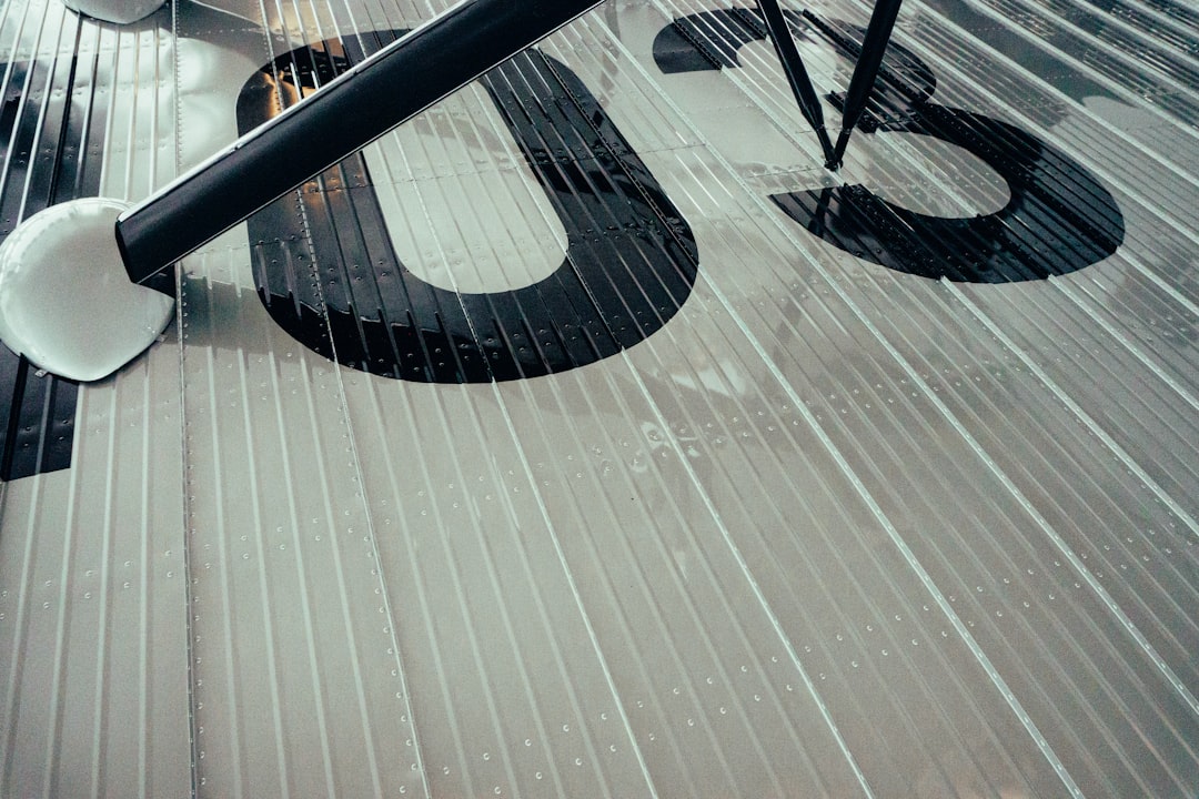 a black and white clock on the side of a building,