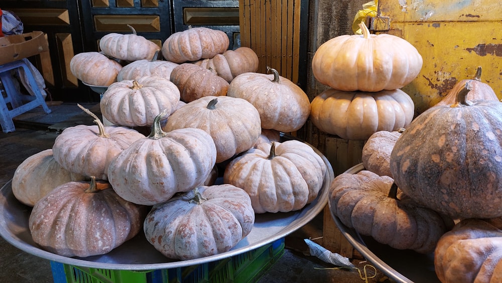 a pile of pumpkins sitting on top of a white plate