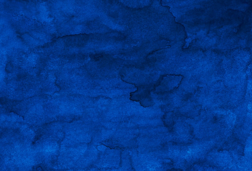 a dark blue background with a rough texture