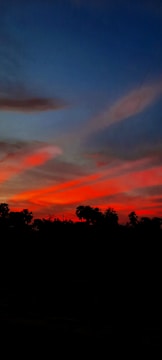 A vibrant sunset painting with bold colors.