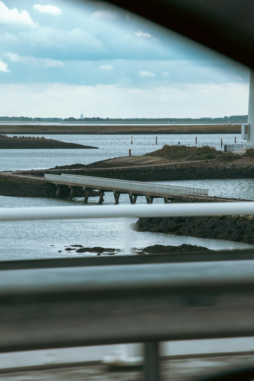 a view of a body of water with a lighthouse in the background