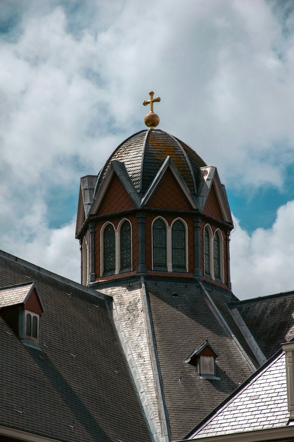 a church steeple with a cross on top