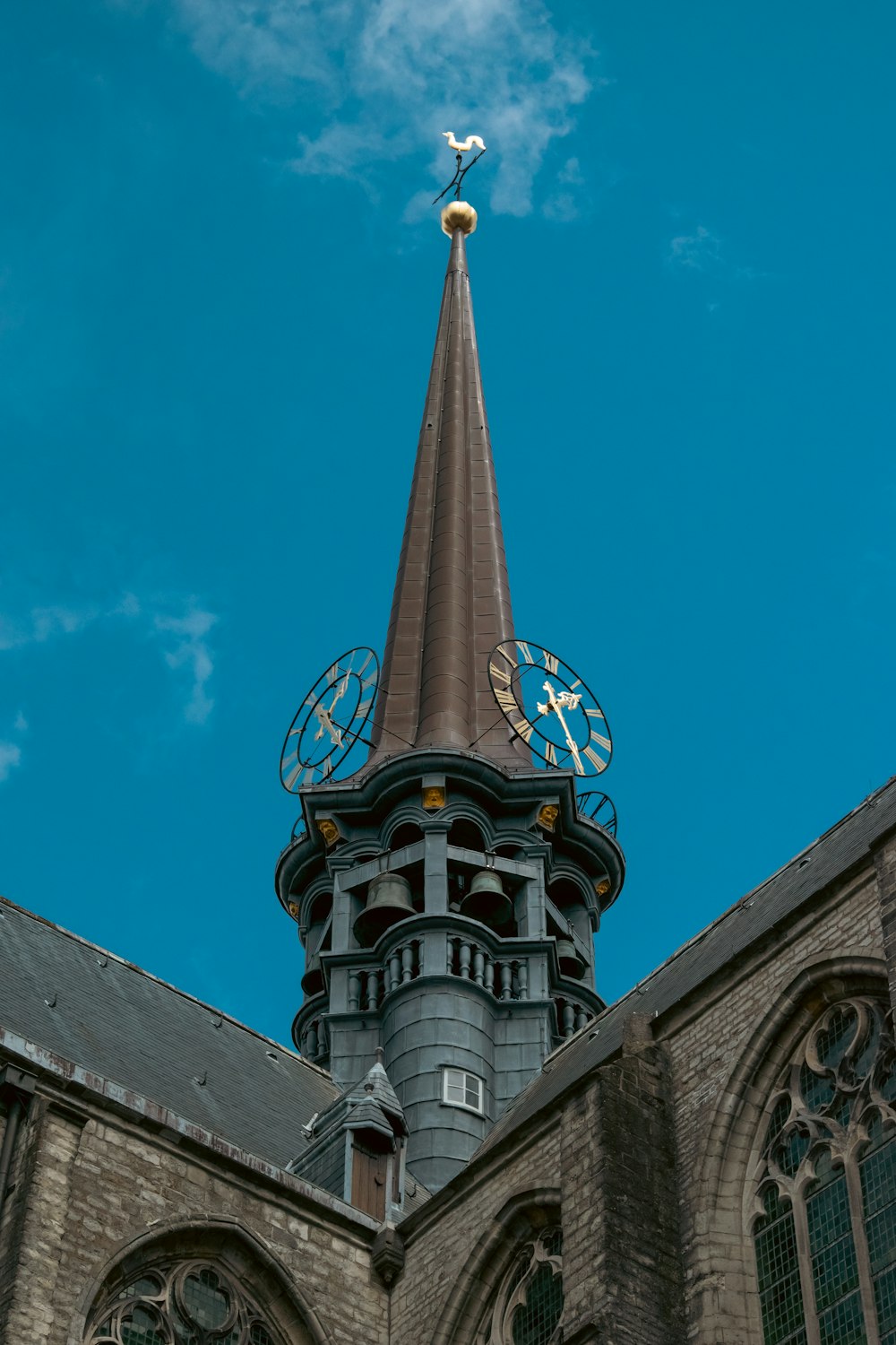 a church steeple with a clock on it