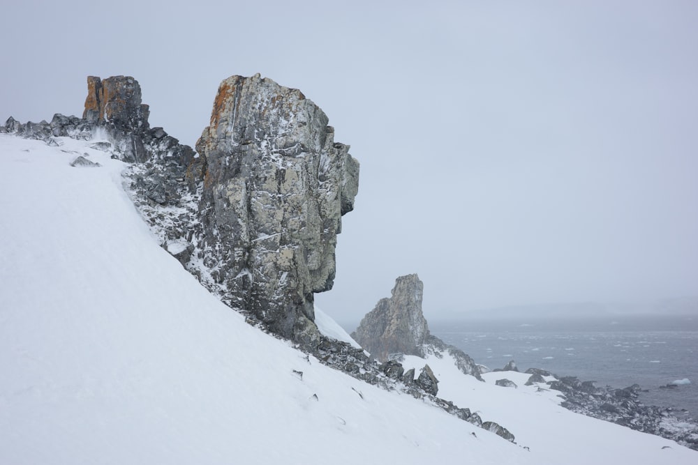 a person on skis is standing on a snowy hill