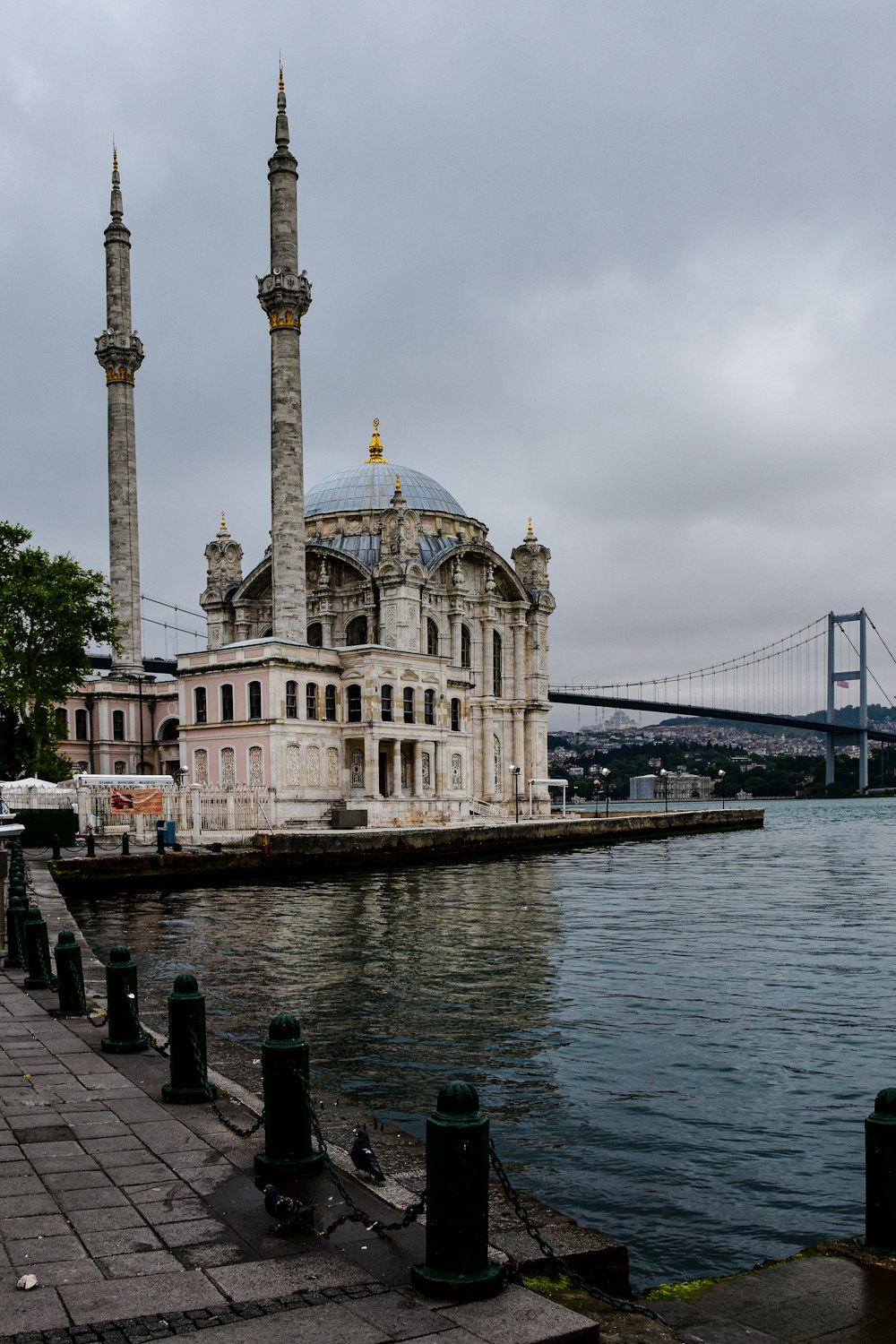 a large building sitting next to a body of water