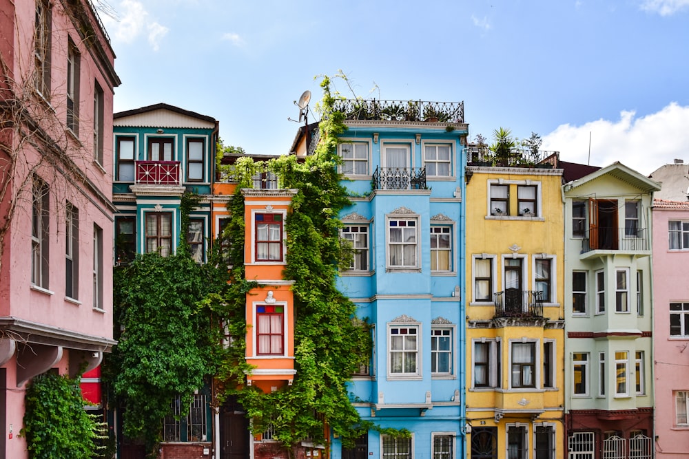 a row of multicolored buildings in a city