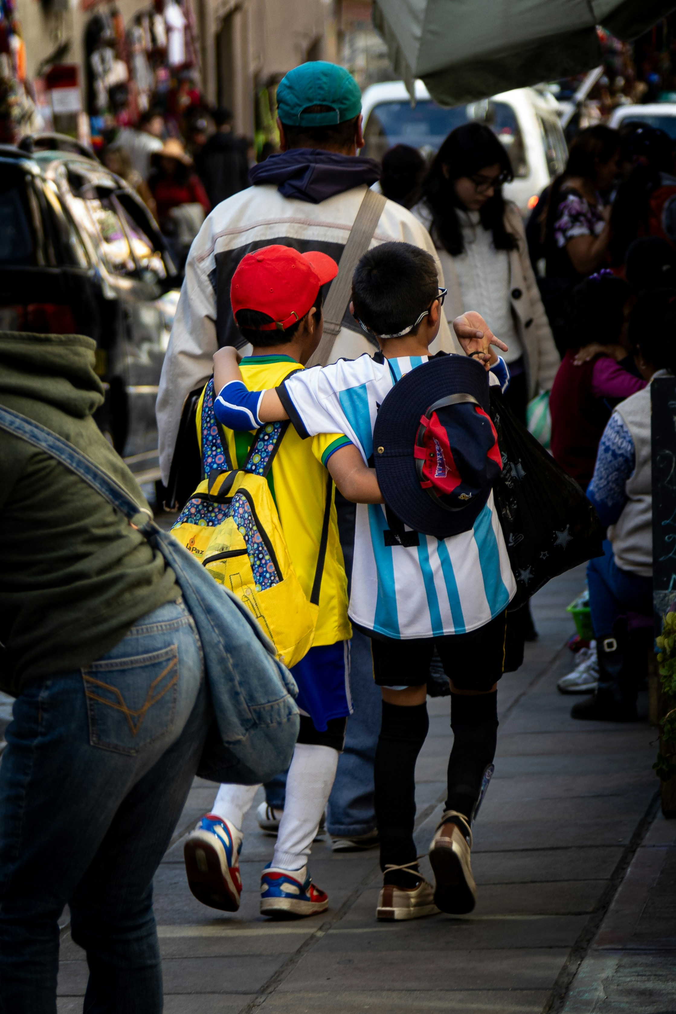 a group of people walking down a street