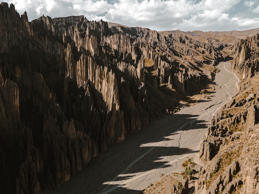 a view of a narrow road in the mountains