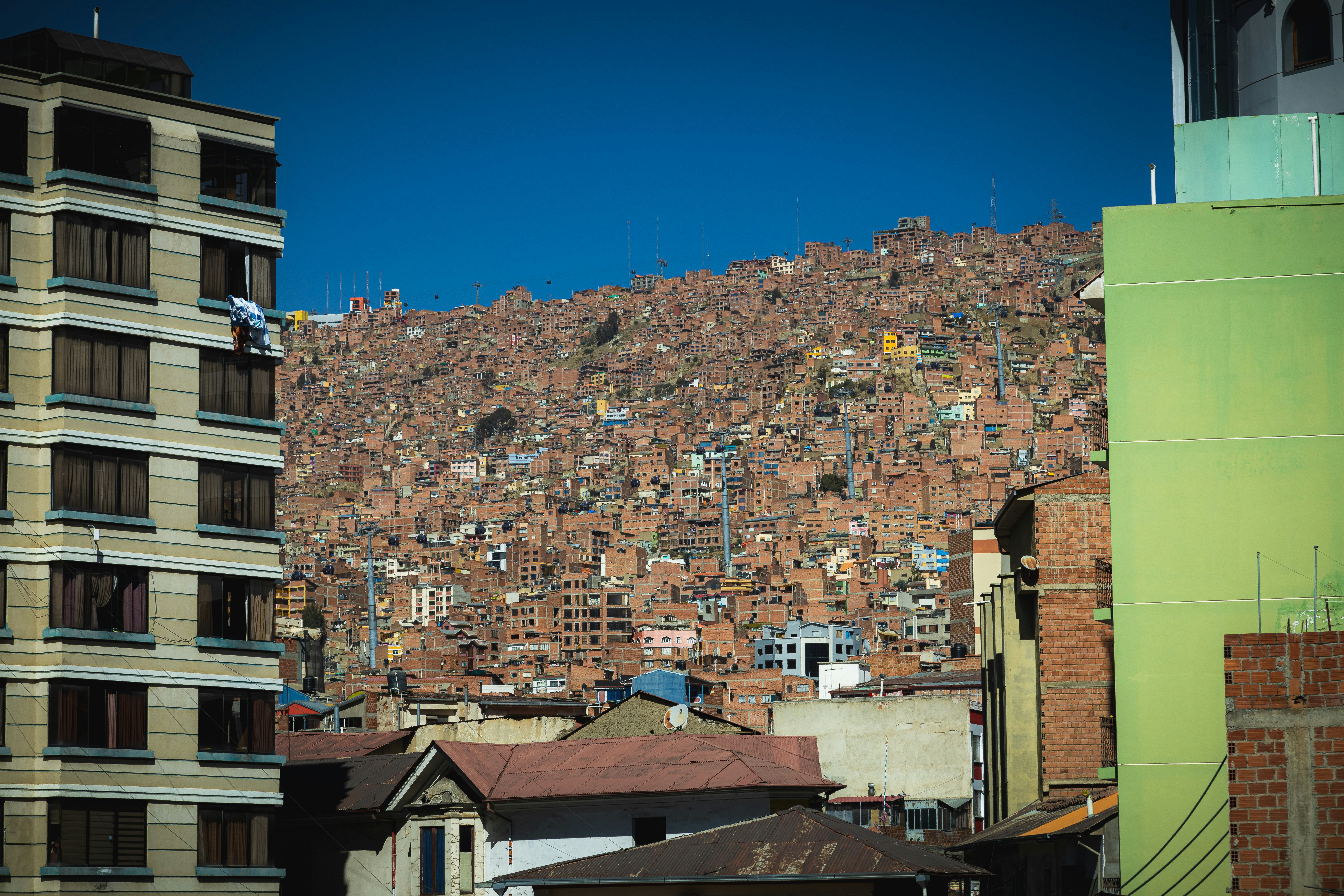 a city with a hill of buildings in the background