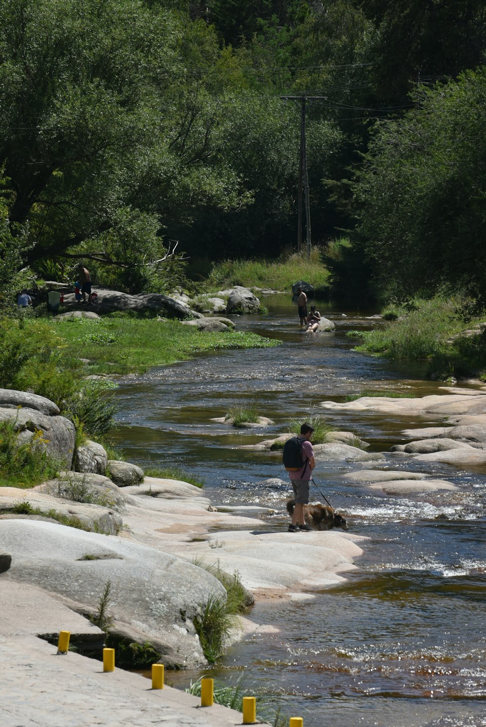 a person standing on a rock in a river