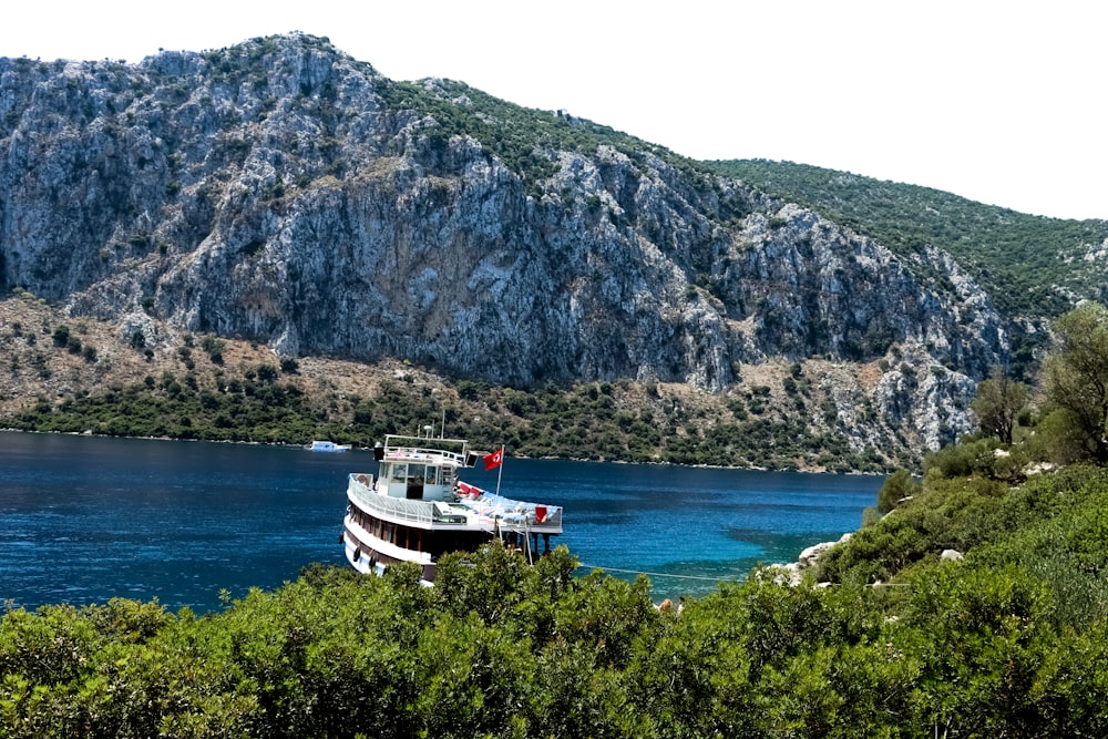 a large boat floating on top of a body of water