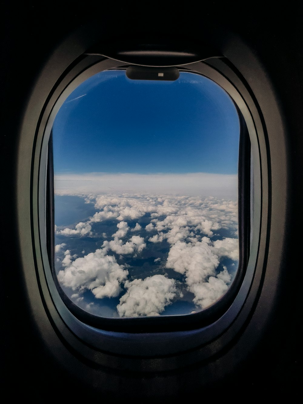 the view out of an airplane window of clouds
