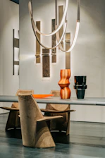 Modern dining area with sleek chairs and a minimalist table setup.