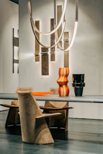Modern dining area with sleek chairs and a minimalist table setup.