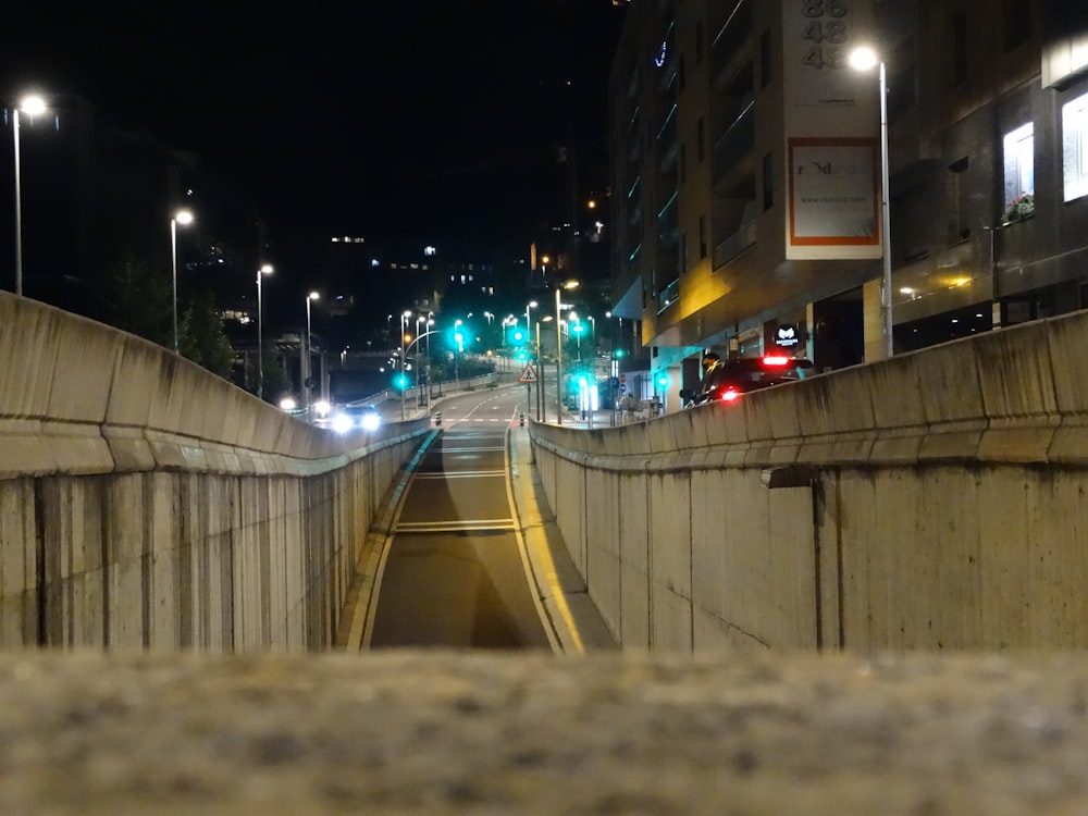 a city street filled with lots of traffic at night