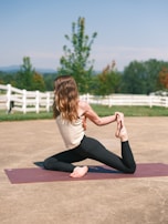 A serene yoga scene in a peaceful outdoor setting.