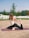 A serene yoga class in a peaceful outdoor setting.